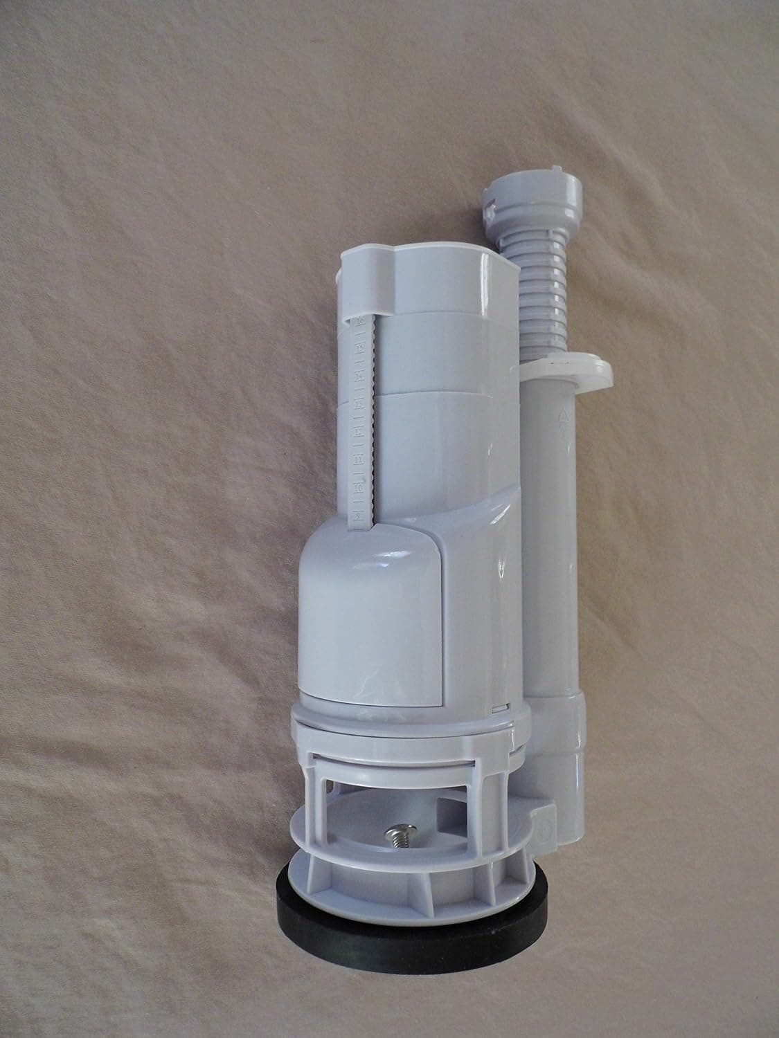 Dual Flush Top Button, Two Piece Toilet Replacement, Top Operated Dual Flush Valve Two Inch Flush Outlets Eight inches Tall.